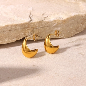Polished 18K PVD gold plated chunky drop earrings on natural stone background