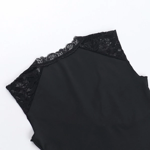 Close-up of black sleeveless top featuring delicate lace stitching and elastic fabric