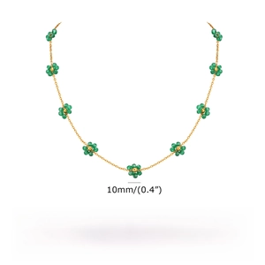 Detail view of gold emerald flower necklace with 45-50cm length and 6g weight specs
