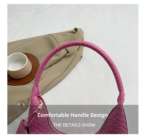 Close-up of pink woven leather texture and elegant handle of the crescent shoulder bag