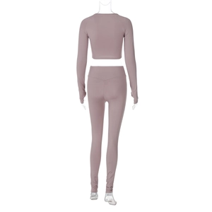 Rear view of dusty pink high-waisted yoga leggings and long sleeve cropped gym top