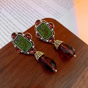 Vintage gold-tone earrings with green stones and dark brown teardrop beads for women