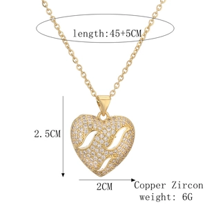 Detail view of 18k gold plated heart pendant with zircon stones and dimension specs
