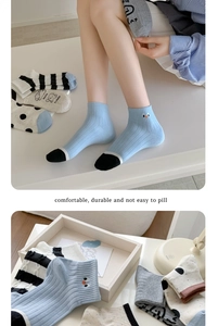 Detail of assorted cotton socks with polka dots and stripes, showing ribbed cuffs