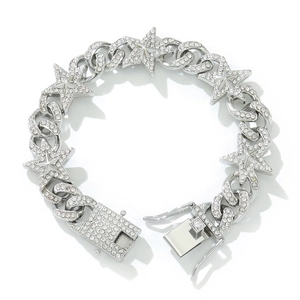 Detail of silver iced-out cuban chain bracelet featuring rhinestone five-pointed stars