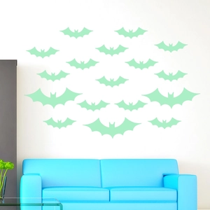 Detail of mint green glow-in-the-dark bat wall stickers for Halloween home decor