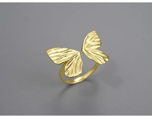 Detail shot of a S925 silver adjustable butterfly ring with golden textured wings
