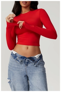 Close-up of red long sleeve cropped yoga top with high-stretch slim fit fabric