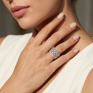 Luxury sterling silver lace mesh ring with moissanite pavé stones on female hand