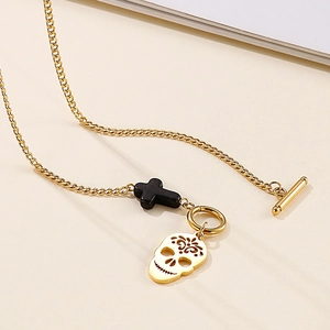 Golden stainless steel skull and black cross pendant necklace with OT toggle clasp