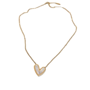 Minimalist gold heart pendant necklace with white mother of pearl inlay on white background