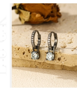 Detailed view of S925 sterling silver hoop earrings with round moissanite in black finish