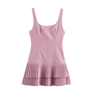 Detail of pink mini dress featuring delicate pleats and elegant sleeveless strap design