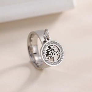 Polished stainless steel ring with tree of life pendant and sparkling rhinestone border