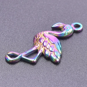 Macro detail of iridescent flamingo pendant with colorful rainbow metallic finish