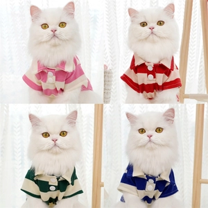Detail of striped pet polo shirts in four colors with breathable piqué cotton fabric texture