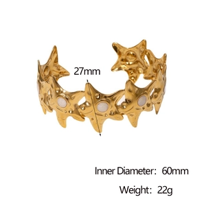 Detail view of gold stainless steel starfish cuff bracelet with 27mm width and dimensions
