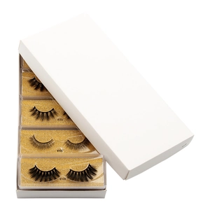 Macro shot of 3D faux mink eyelashes in assorted styles #100 #101 #109 with glitter boxes