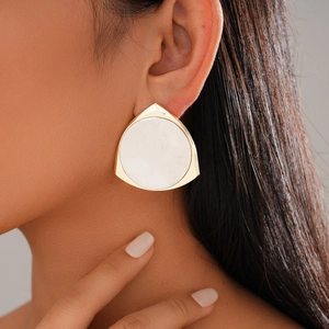 Minimalist 14K gold plated triangle stud earrings with white inlay shown on model