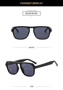 Front and side views of stylish oversized black frame sunglasses with black lenses