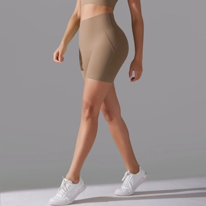 Side view of khaki high-waisted yoga shorts showing tummy control and seamless design