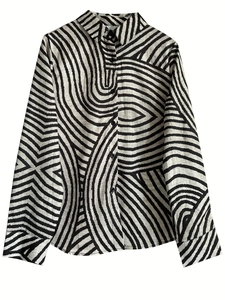 Close-up of button-down front on long-sleeve shirt with black and white swirl pattern
