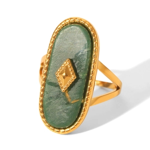 Close-up of 18K gold-plated ring with an oval green natural stone inlay and metal details