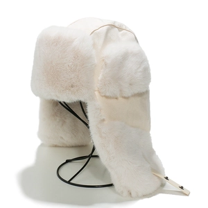 Winter faux fur trapper hat in cream white featuring plush lining and adjustable ear flaps