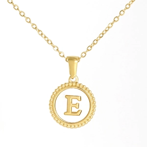 Close-up of 18K gold stainless steel necklace with a circular letter E pendant