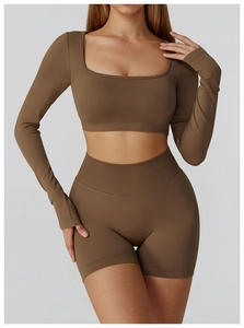 Detail of coffee brown seamless yoga set featuring ribbed high waistband and knit texture