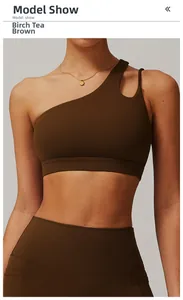 Detail of one-shoulder sports bra in Birch Tea Brown with hollow-out back design
