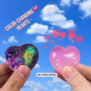 Squeezable heart stress relief toy with purple glitter and pink translucent design