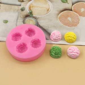 Detailed top view of 4-cavity pink silicone mold for ice cream and mousse spheres