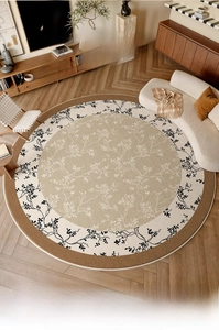 Detail of a round floral rug with leaf patterns in a modern wood-style living room