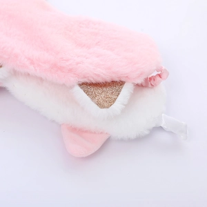 Detailed view of soft pink and white plush sleep mask with glitter cat ears and fluffy texture