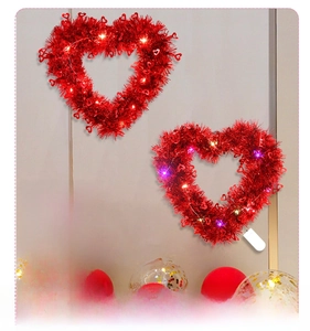 Close-up of 30cm heart-shaped red sequin wreath with warm LED lights for Valentine décor