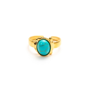 Detail view of gold adjustable steel ring with oval turquoise stone and engraved patterns
