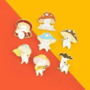 Detailed close-up of colorful enamel cat pins playing instruments with mushroom hats