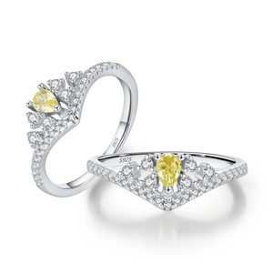 Elegant S925 silver crown ring featuring a pear-cut yellow gemstone with halo diamonds