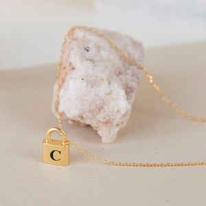 Minimalist gold padlock necklace with black letter C pendant and fine cable chain