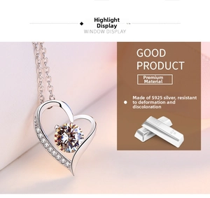 Detail of S925 silver heart necklace featuring a large zircon centerpiece and fine o-chain
