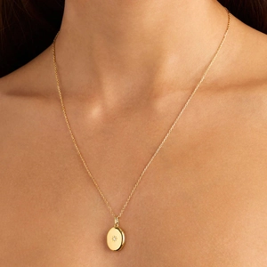 S925 sterling silver gold starburst oval locket pendant necklace worn on neck