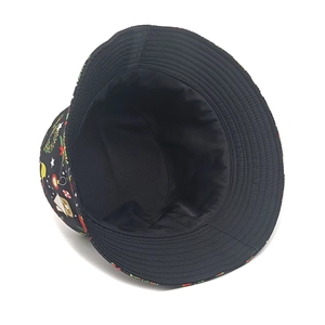 Christmas bucket hat featuring festive wreaths and stars print on a black cotton base