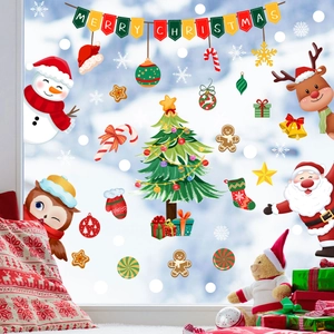 Christmas window decals with Santa, reindeer and snowman on glass with snowy background