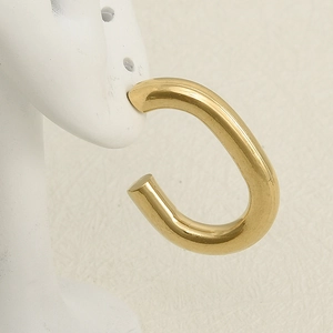 Polished gold U-shaped stainless steel earrings displayed on a white model stand