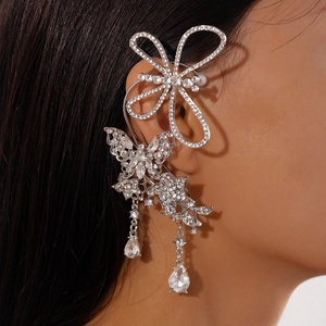 Detailed view of luxury silver butterfly ear cuff with sparkling rhinestones and teardrops