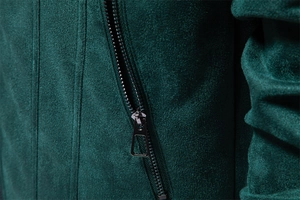 Detail of dark green suede jacket featuring a high-quality gunmetal trapezoid zipper