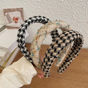 Knitted plaid headbands in diverse patterns featuring a stylish high-top design for women