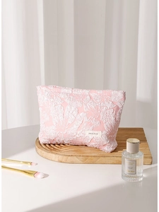 Pink embossed floral jacquard makeup bag with portable canvas design for cosmetics