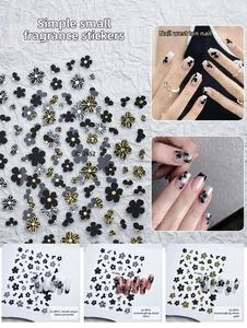Detail view of monochrome camellia nail stickers in black, gold, and silver finishes